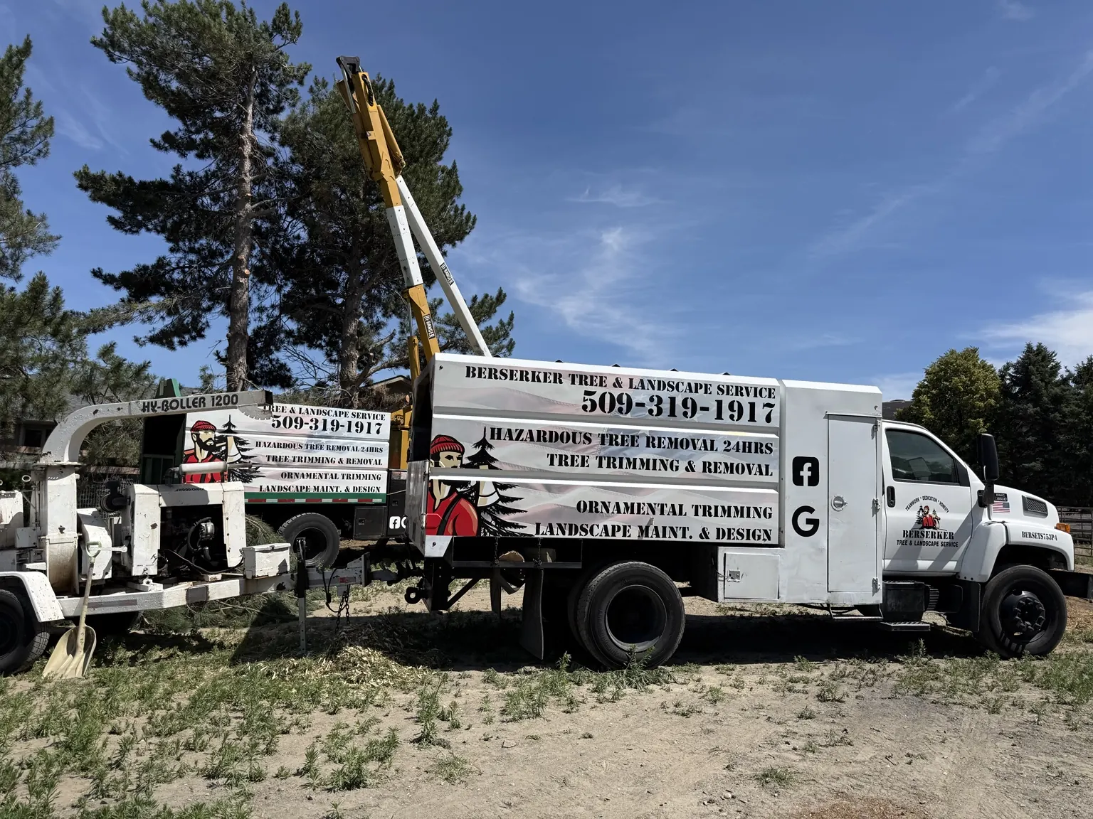 Berserker bucket truck and Hy-Roller 1200 chipper rig on a Tri-Cities job site